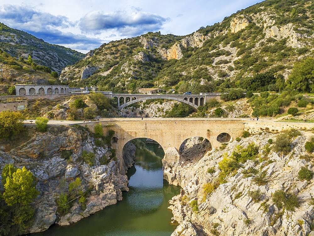 Pont du Diable, the Devil's Bridge, over Hérault River, near Saint Guilhem le Désert, Hérault, Languedoc Roussillon. Saint Jean de Fos, the Pont du Diable over the Herault river on the Routes of Santiago de Compostela, listed as World Heritage by UNESCO, Herault, France.