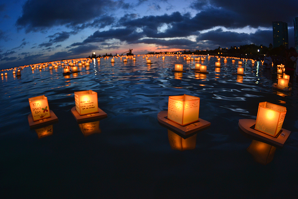 Floating Lanterns at dusk in Ala Moana Beach during Memorial Day celebration, Honolulu, Hawaii, USA