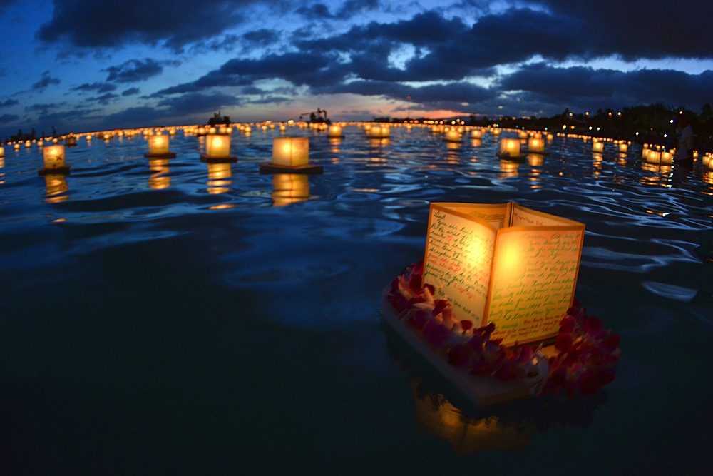 Floating Lanterns at dusk in Ala Moana Beach during Memorial Day celebration, Honolulu, Hawaii, USA