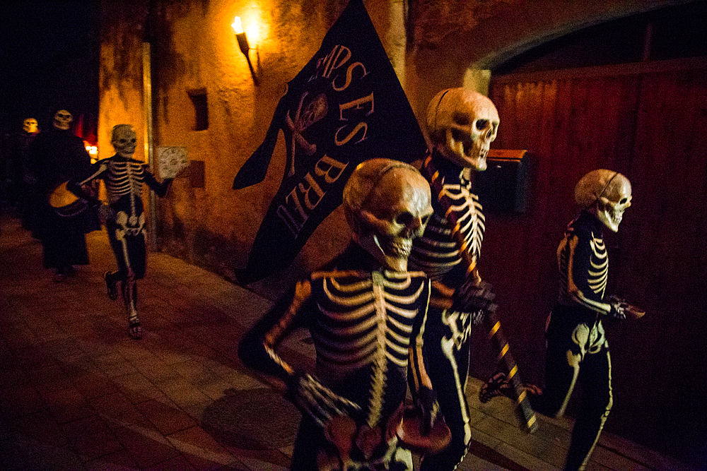 Verges, a small town in the Northeast of Catalonia (Spain), during Easter celebrates the Procession of Verges with skeletons dancing on the sound of a drum, Roman soldiers, known as the 'Manages', and a representation of the life and crucifixion of Jesus Christ. The Procession features the Dance of Death, a tradition from the Middle Age associated with epidemics and plagues and the only one remaining in Spain Ten skeletons dance to the beat of a drum to remember that no one is exempt of death. The backdrop of the medieval walls and towers of Verges is key to this macabre staging.