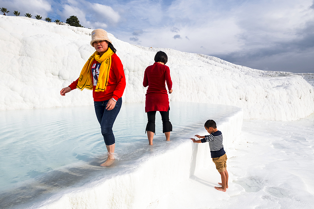 Travertine terrace formations at Pamukkale and tourists