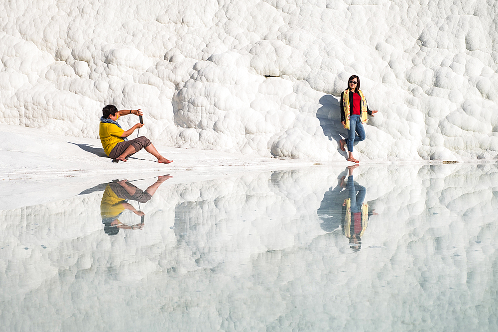 Travertine terrace formations at Pamukkale and tourists