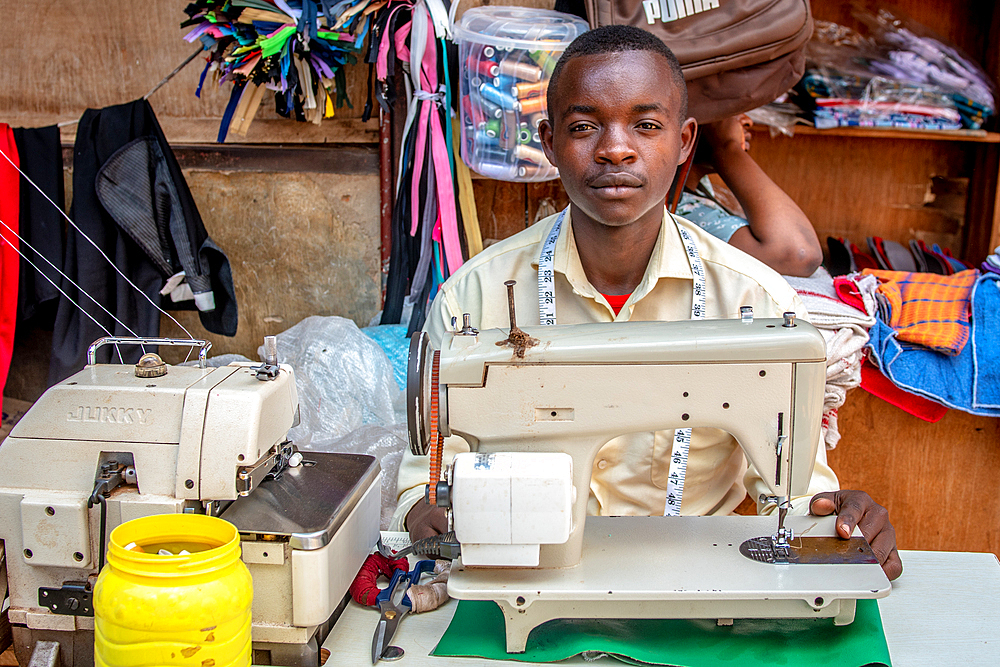 Man with sewing machine Kimironko Market, Kigali Rwanda