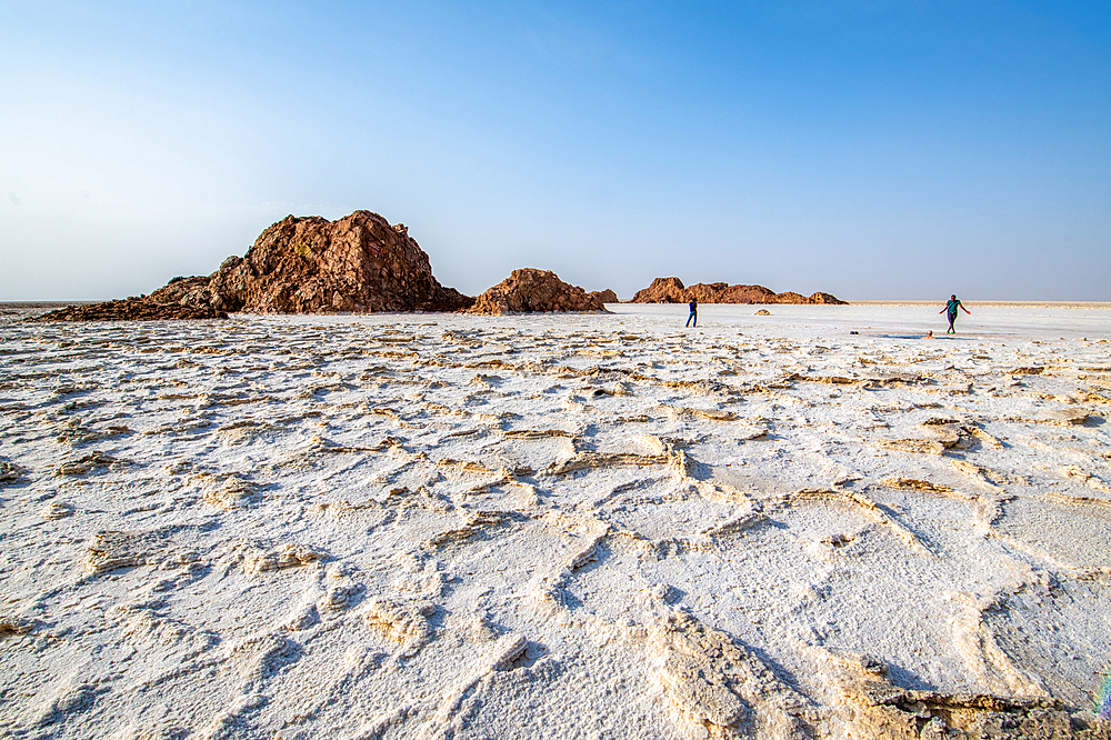 Tourist walk on salt flats in the Danakil Depression, Ethiopia