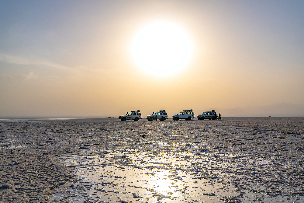 Land Cruisers and tourists in the middle of a salt flats in Danakil Depression, Ethiopia