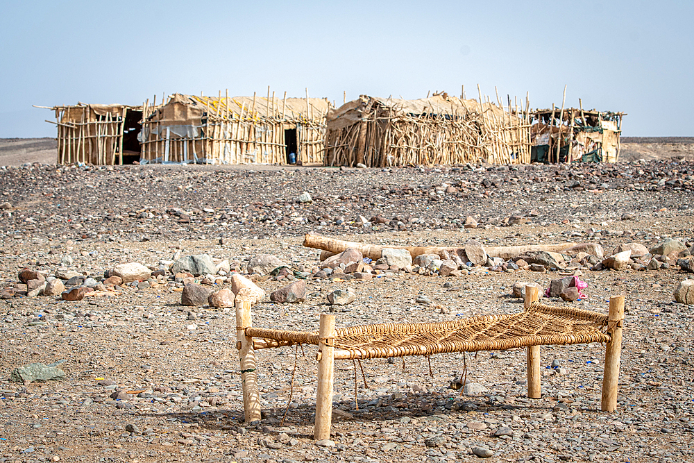 Shelters and cots at a salt miner campsite in the Danakil Depression, Ethiopia