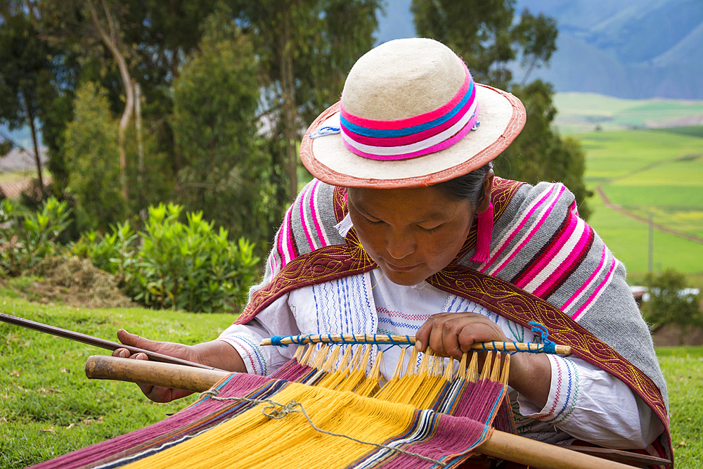 Quechua woman weaving cloth in Misminay Village, Sacred Valley, Peru.