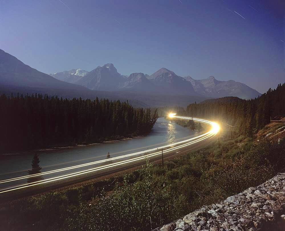 Taken from Morant's Curve on Bow Valley Parkway in Banff National Park near Lake Louise, Alberta. Lone dot of light on distant mountain must be from Lake Agnes Tea House on Little Beehive Peak above Lake Louise.