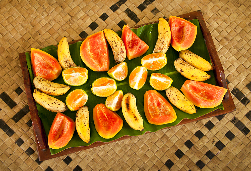 Bananas, papaya and oranges on fruit tray at Bulou's Eco Lodge, Navala Village, Viti Levu Island, Fiji.