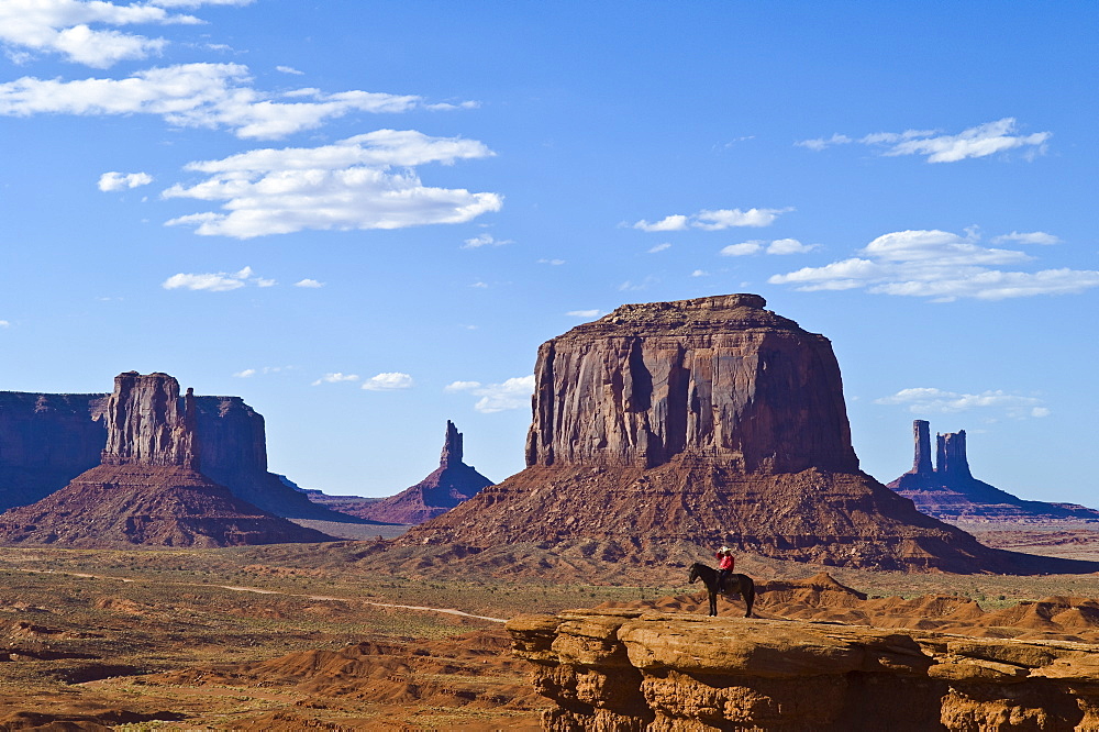 Monument Valley with Navajo man posing on horseback at John Ford?s Point; Monument Valley Navajo Tribal Park on the Utah-Arizona border.