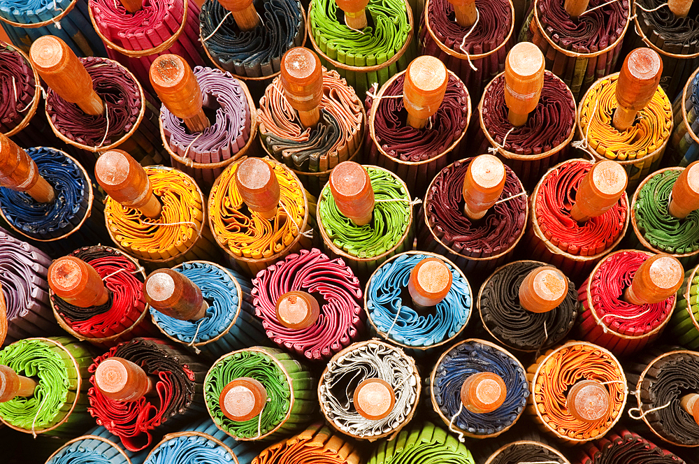 Rolled up umbrellas at The Umbrella Factory in Chiang Mai, Thailand.