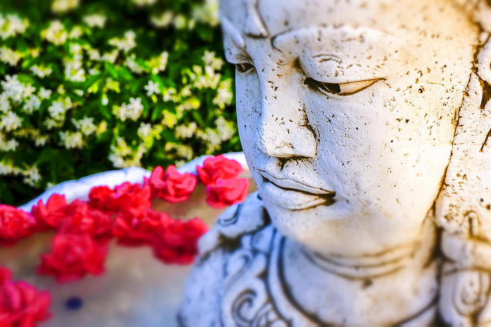 Brahma statue in a garden.