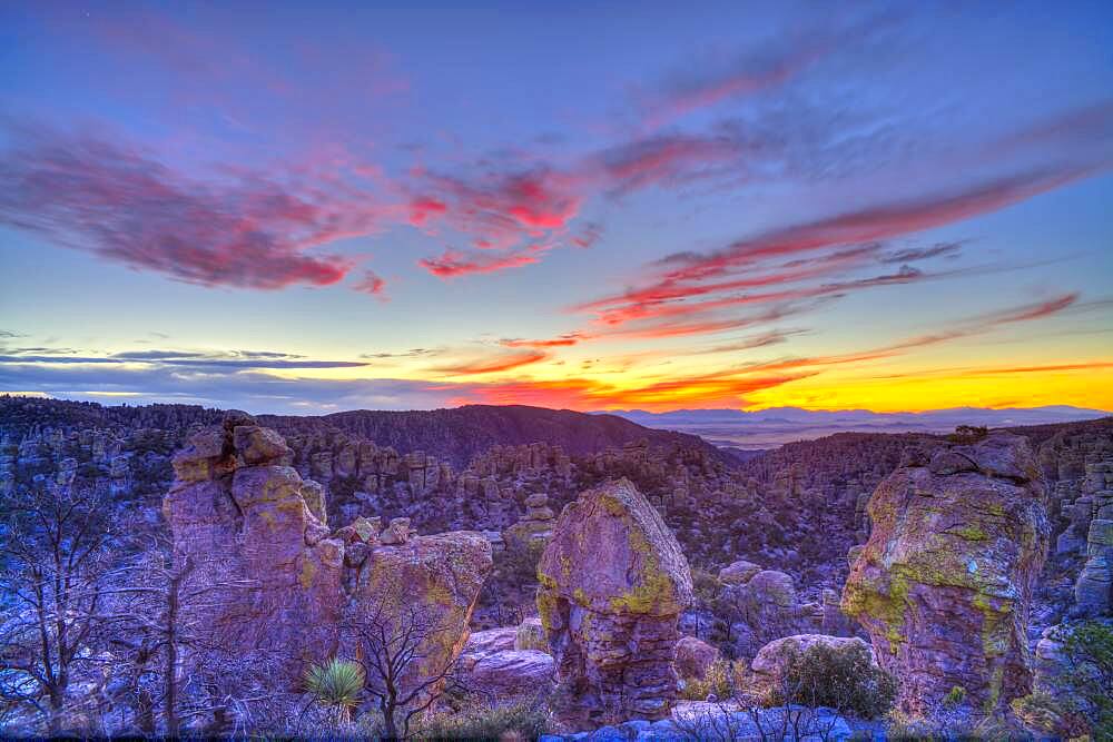 Sunset clouds and colours on December 3, 2013 from Massai Point, Chiricahua National Monument, Arizona. This is a 7-frame HDR High Dynamic Range stack to compress the high contrast from the bright sky and dark foreground into one image. Combined with Photomatix Pro. Taken with the Canon 5D MkIi and Canon 24mm lens at f/8. From images _MG_6996_6997_6998_6999_7000_7001_7002 taken at 2/3rd stop increments.