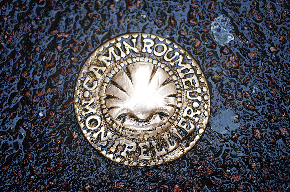 Water sewer in Montpellier France

A symbol on the ground warns us that the Camino de Santiago Way of St. James also passes through Montpellier. The Via Tolosana is the Latin name for one of the four routes in France on the Camino de Santiago, the southernmost. It passes through Toulouse (in Spanish and Occitan, Tolosa, hence its name), but its meeting point and starting point is Arles.