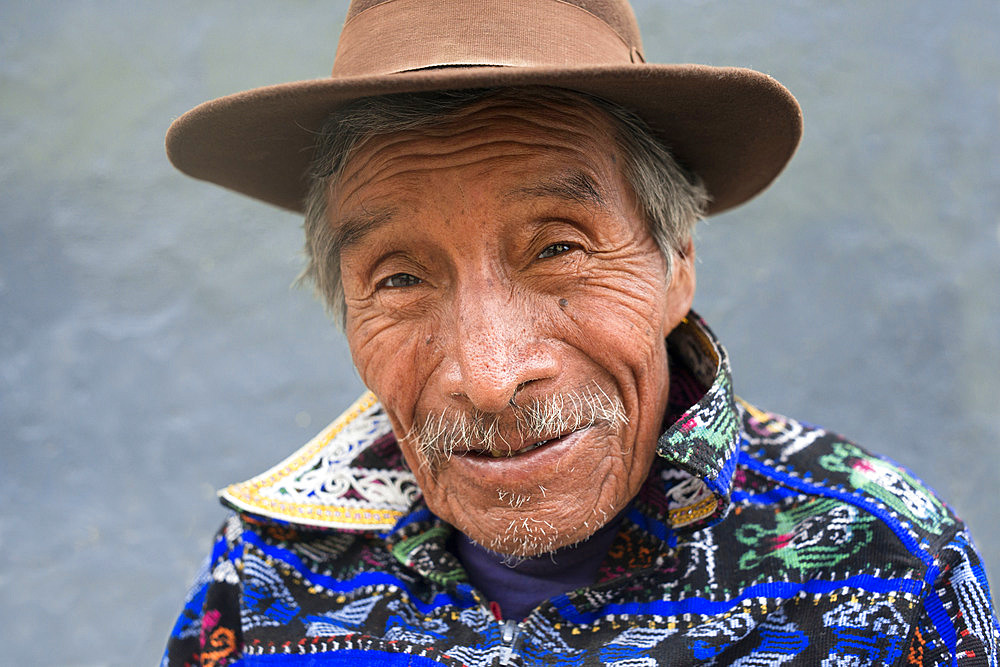 Portrait of a man in traditional dress remain in one of the streets of Chichicastenango, Guatemala.