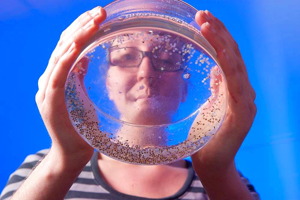 Woman conducting research in an aquaculture lab at Delaware State University