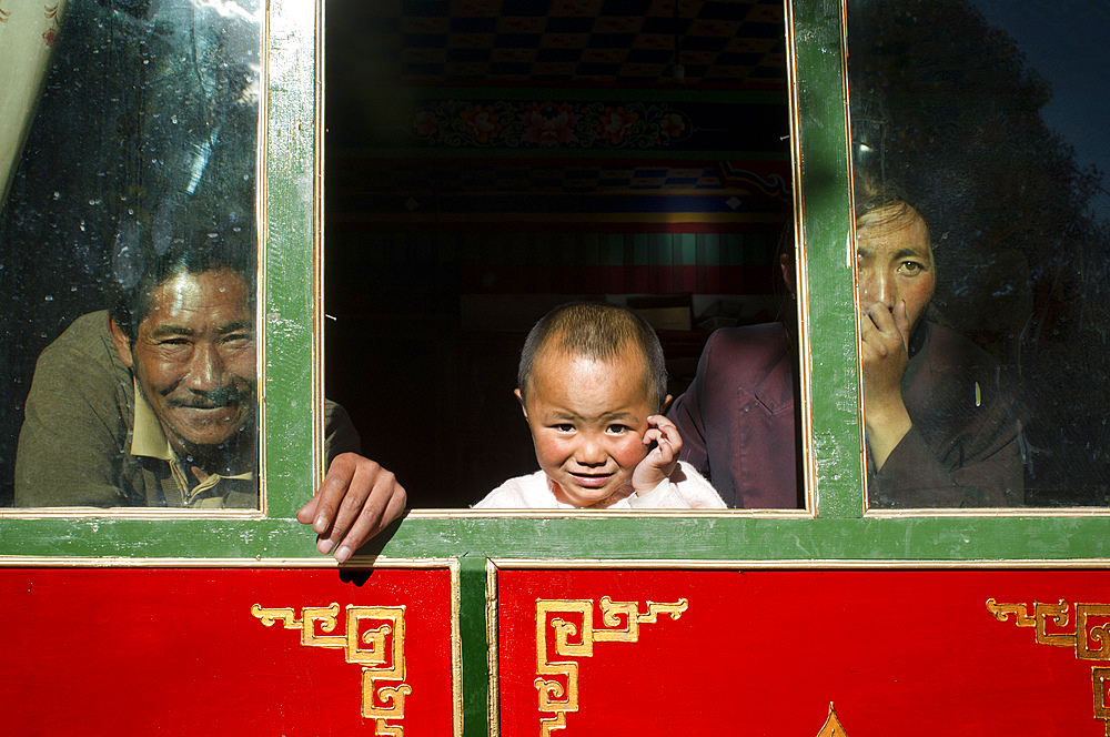 Local people inside a house in Gyantse village or Gyangze town, Tibet, China. Located in the northeast of Gyantse at 3900 meters above sea level. Pelkor Chode Monastery, or rather Palcho Monastery in Tibetan language means auspicious monastery. It was first built in early 15th century and took 10 years to complete. Because it was built when different religious sectors conflicted neck and neck in Tibet, Sakyapa, Kadampa and Gelukpa of Tibetan Buddhism coexist in it. Each religious sector has five to six Dratsang schools in the monastery.