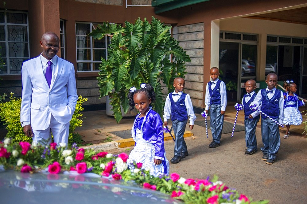 Rich family dressed to go to Christian sunday mass in a small village near Kitui in the Kamba country in Kenya, Africa.