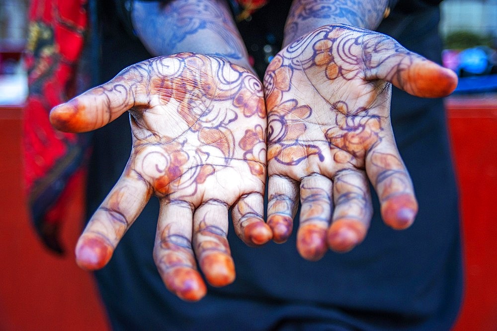 Woman shows Hand Palm Painted With Henna And Indigo in Lamu, Lamu Archipelago, Kenya