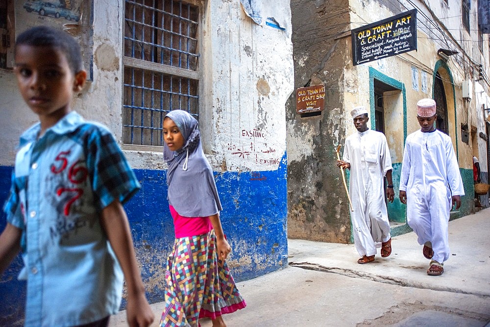 Local people in a narrow street of Lamu town in Lamu Island, Kenya.