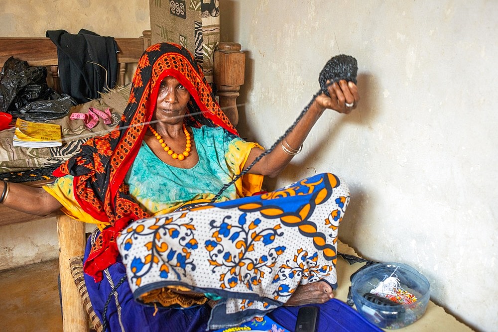 Sewing cloths to make souvenirs. Afrikable spanish NGO in Lamu island Kenya. This association tries to empower women who have been victims of abuse. By making souvenirs that are later sold in the village store and the schooling of their children.