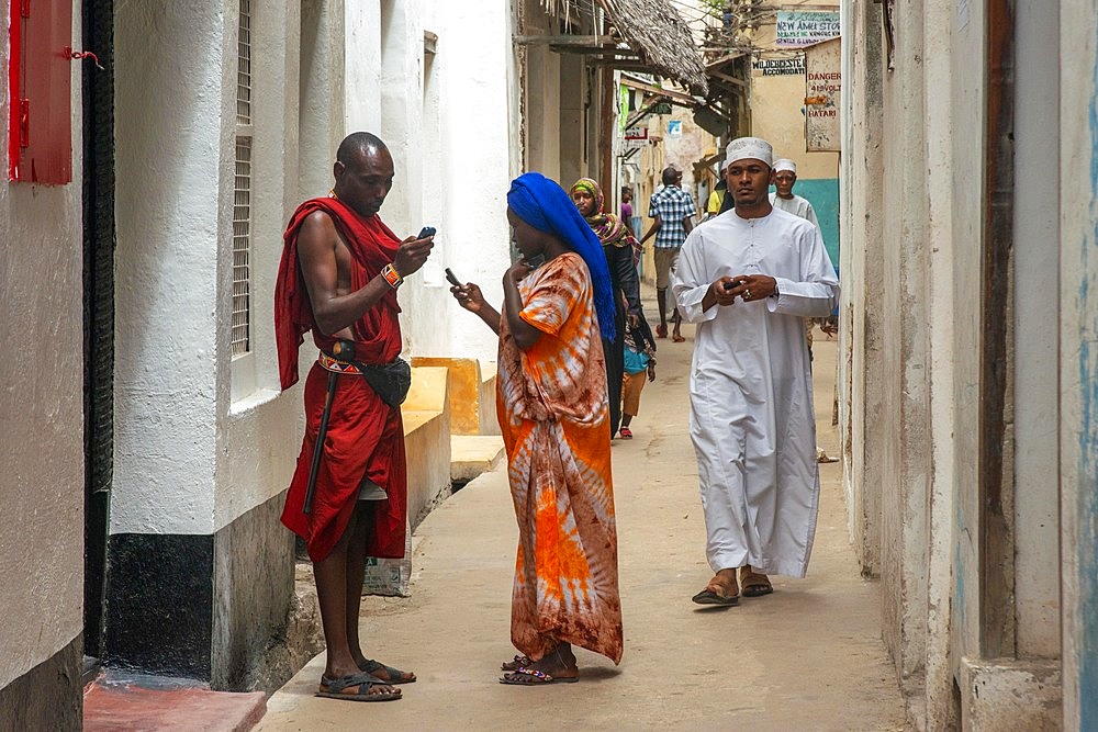 Local people in the narrow strees of the city town of Lamu island in Kenya