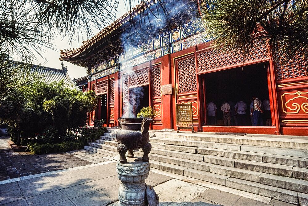 A large bronze censor of incense burner in front of the Lama Temple, a Buddhist temple in Beijing, China.