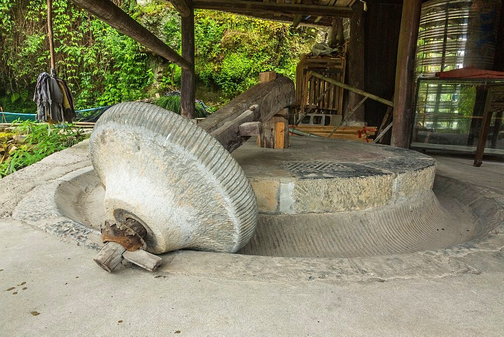 An old stone grist mill in the ancient town of Furong, China.