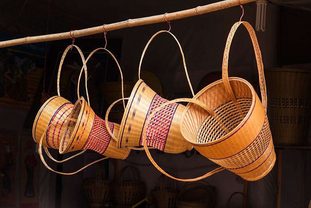 Woven bamboo baskets with back straps for sale on the street in the ancient town of Furong, Hunan, China.