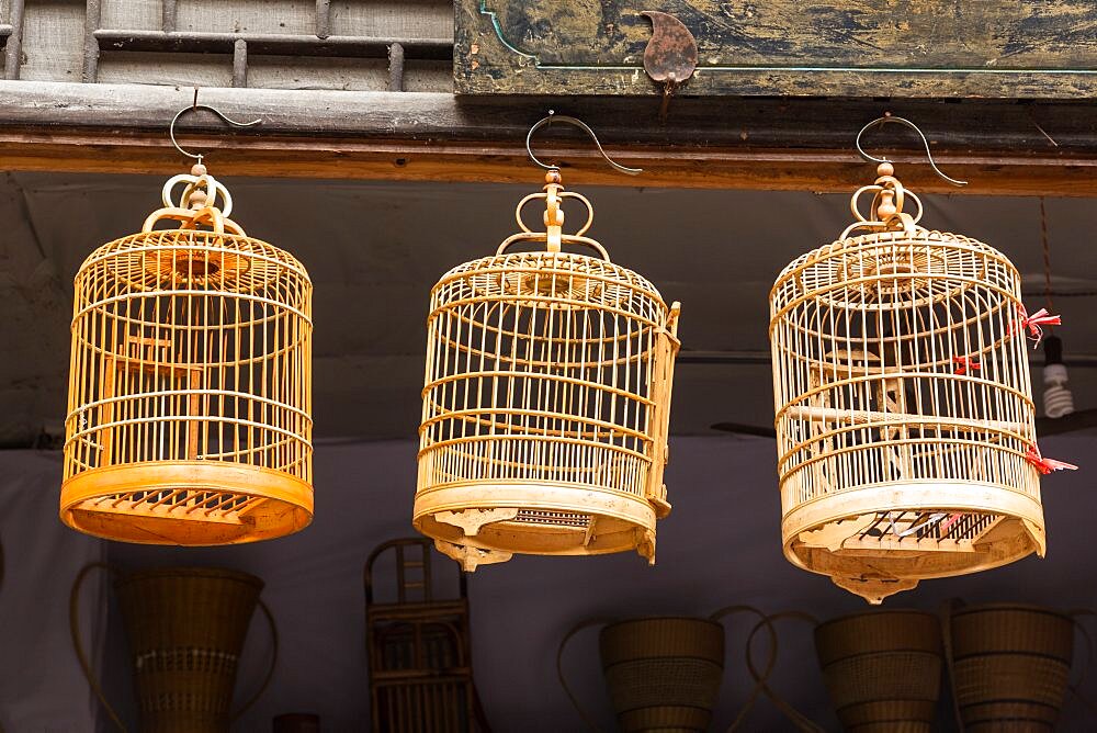 Split bamboo birdcages on display for sale on the street in the ancient town of Furong, Hunana, China.