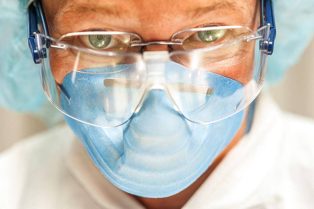 Scientist in necropsy lab wearing safety equipment