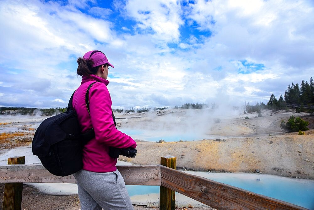 Young woman in Norris Geyser Basin, Yellowstone National Park, USA