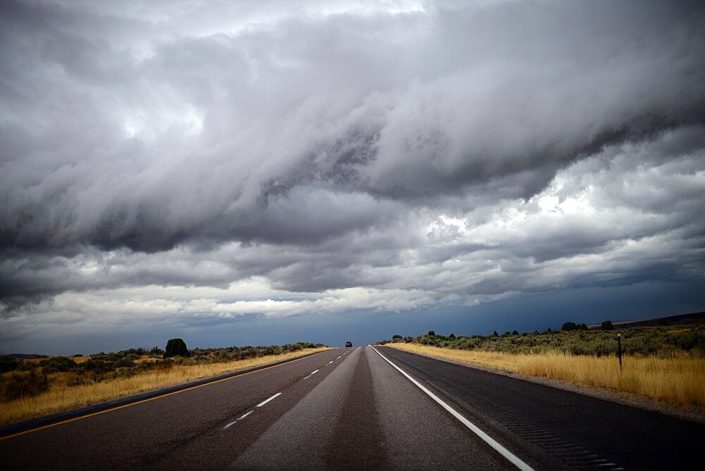 View of stormy clouds from inside car, Yellowstone, USA