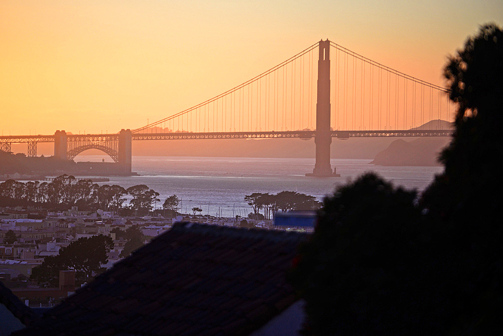 View of San Francisco and Golden Gate Bridge at sunset,