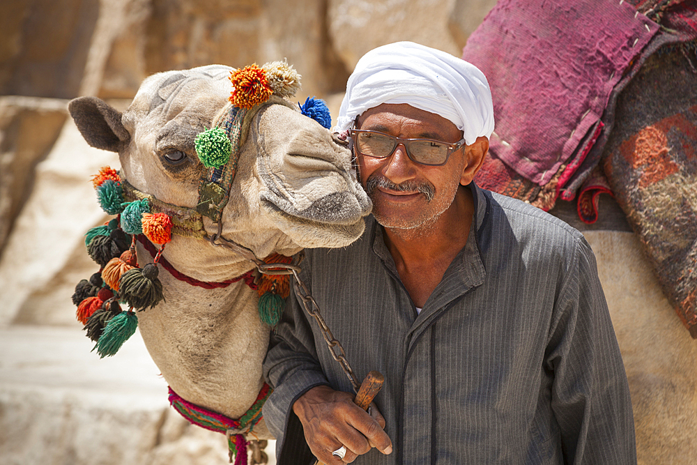 Man posing with a camel, Giza, Cairo, Egypt