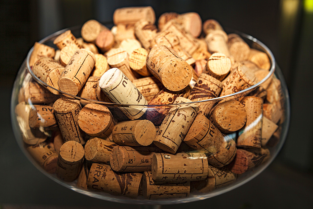 Glass full of wine bottle corks, Vigne Surrau, Surrau Vineyard, Arzachena, Sardinia, Italy