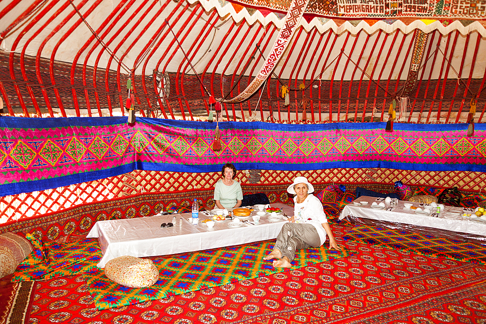 Tourists dining in a yurt, Ayaz Kala Yurt Camp, Ayaz Kala, Khorezm, Uzbekistan