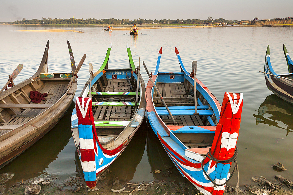 Boats on Taungthaman Lake beside U Bein wooden bridge, Amarapura, Mandalay, Myanmar, (Burma)