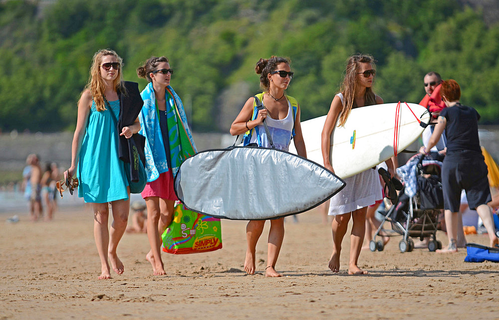 Surfers on Cote des Basques beach at sunset, Biarritz