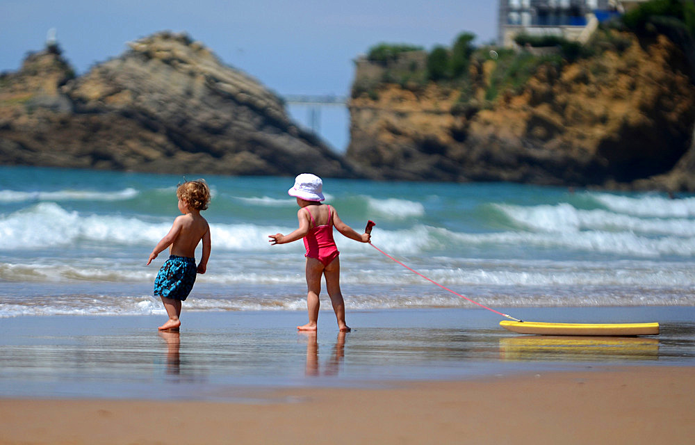 Children playing at Cote des Basques beach, Biarritz