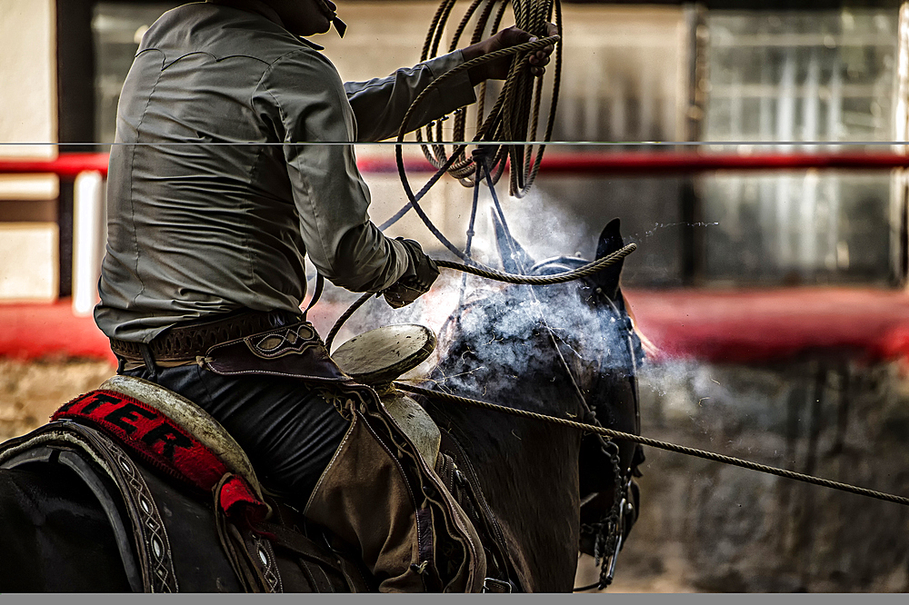 That smoke is the result of heat generated by the rope wound around the saddle horn actually burning through the horn,