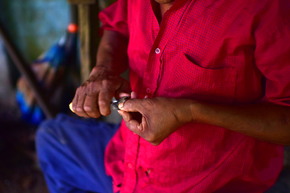 Catato L?pez, Bribri man working on handmade necklace, A day with the Bribri, indigenous people in Lim?n Province of Costa Rica