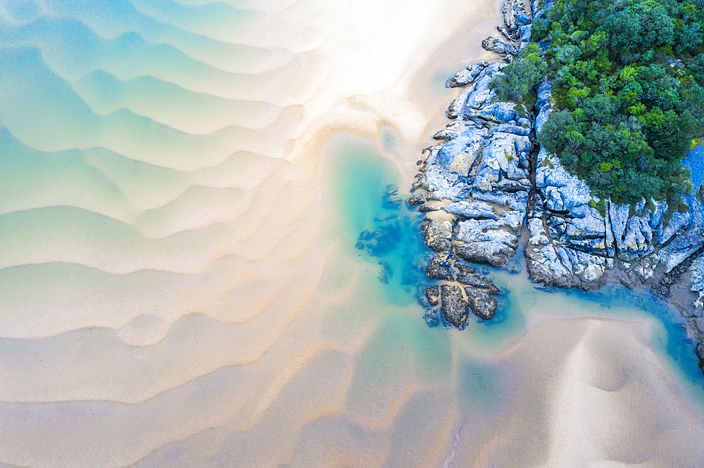 Sandy sediments in low tide in a river close to the sea. Isla, Cantabria, Spain, Europe.