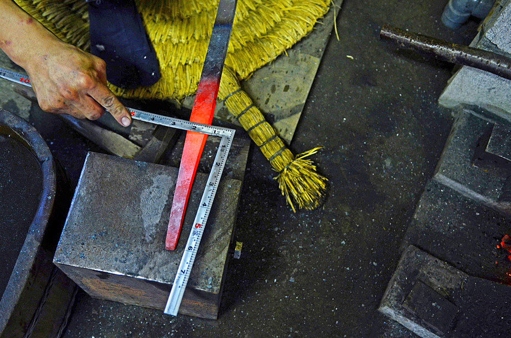 Japanese Swordsmith, Muneyasu, working at his studio in Saitama, Japan. He is part of the new generation of talented katana makers.