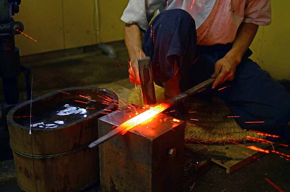 Japanese Swordsmith, Muneyasu, working at his studio in Saitama, Japan. He is part of the new generation of talented katana makers.