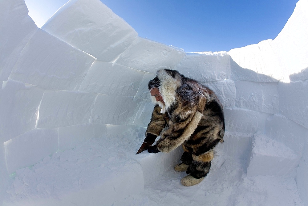 Building an igloo in Gojahaven, an Inuit settlement in the far north of Canada