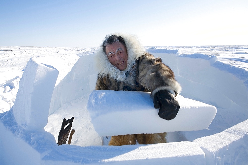 Building an igloo in Gojahaven, an Inuit settlement in the far north of Canada