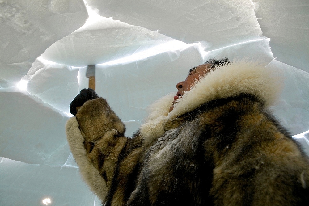 Building an igloo in Gojahaven, an Inuit settlement in the far north of Canada