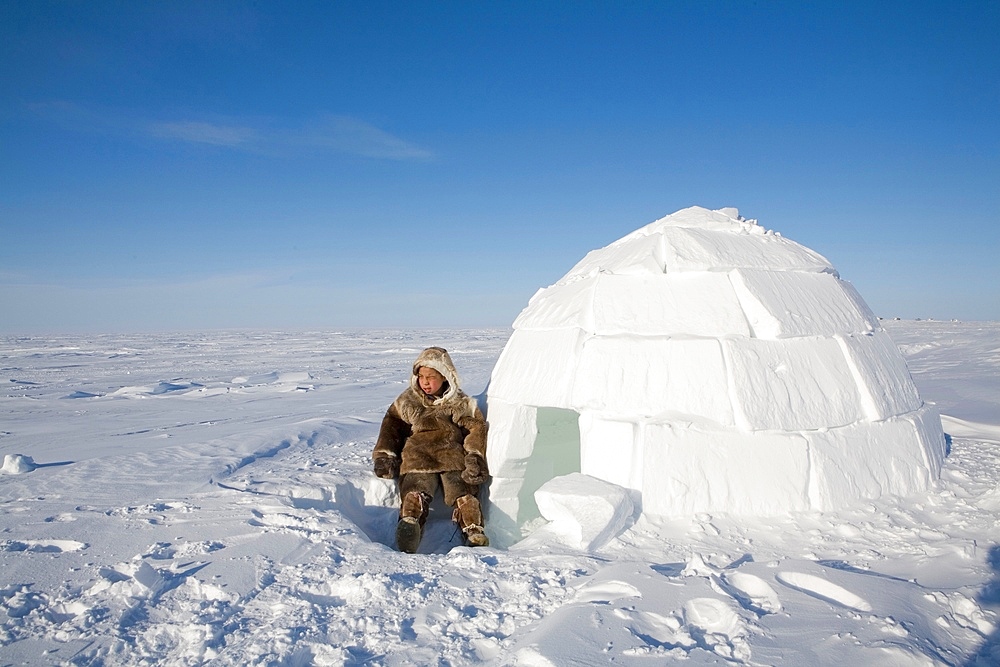 Building an igloo in Gojahaven, an Inuit settlement in the far north of Canada