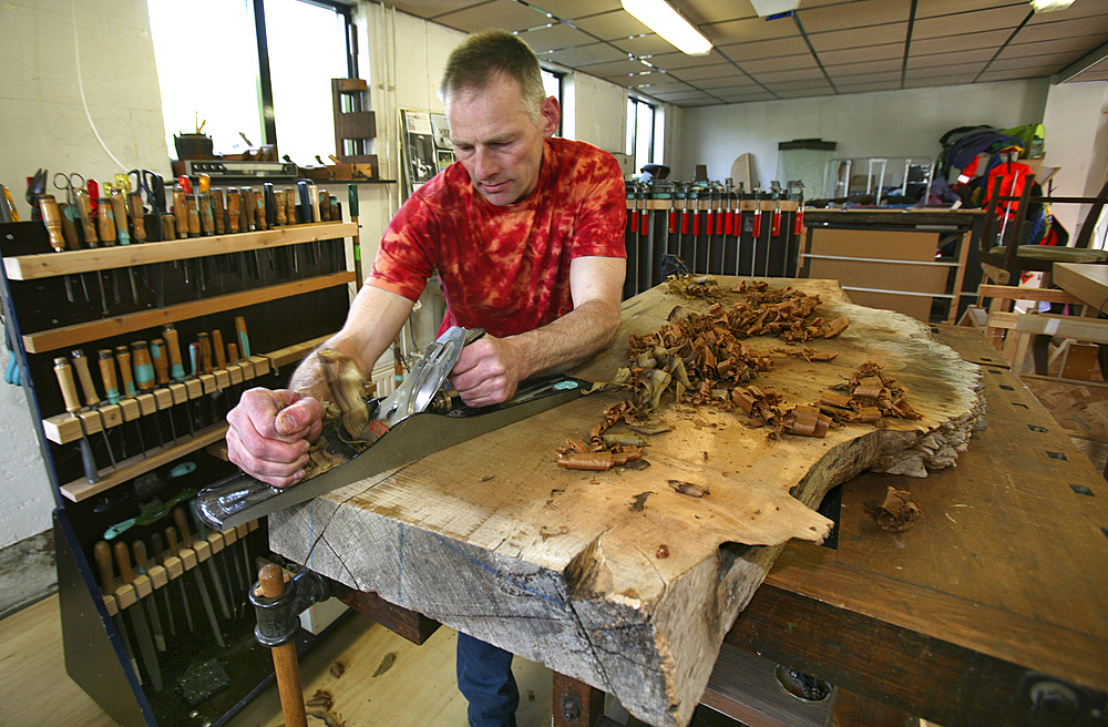 furniture maker at work in his workshop